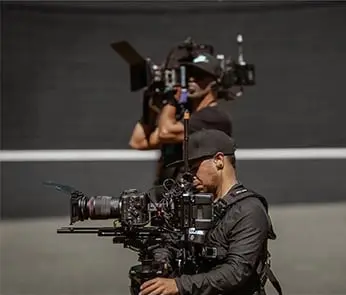 two men with video cameras